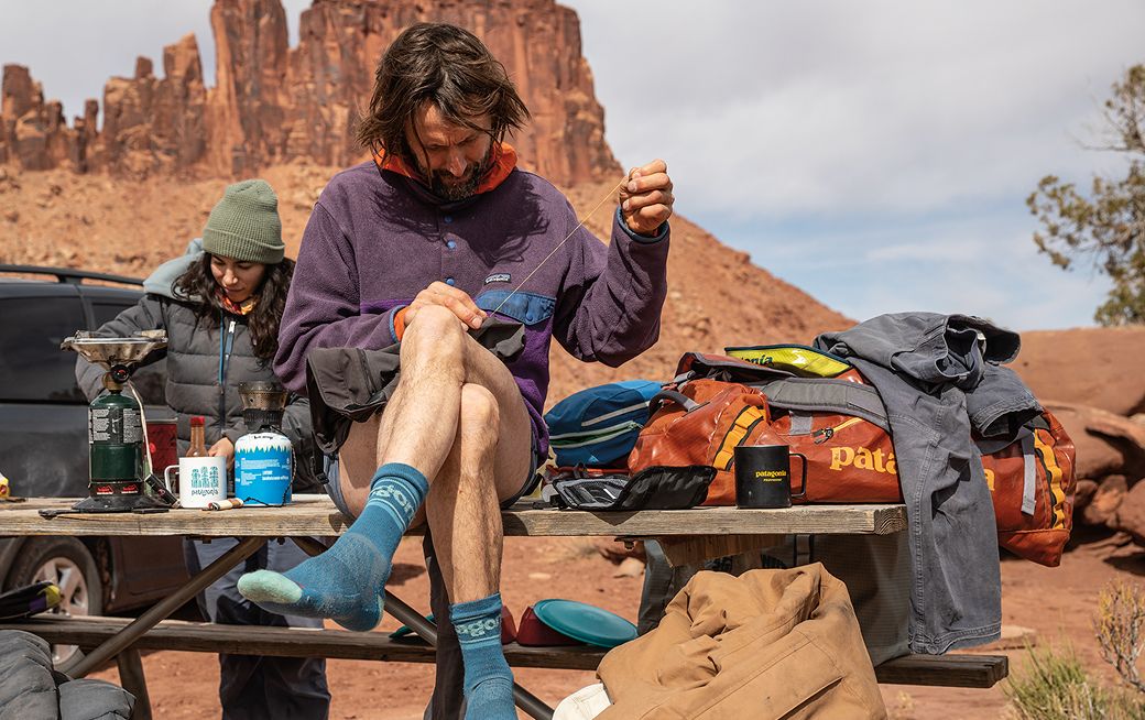 Man sewing gear