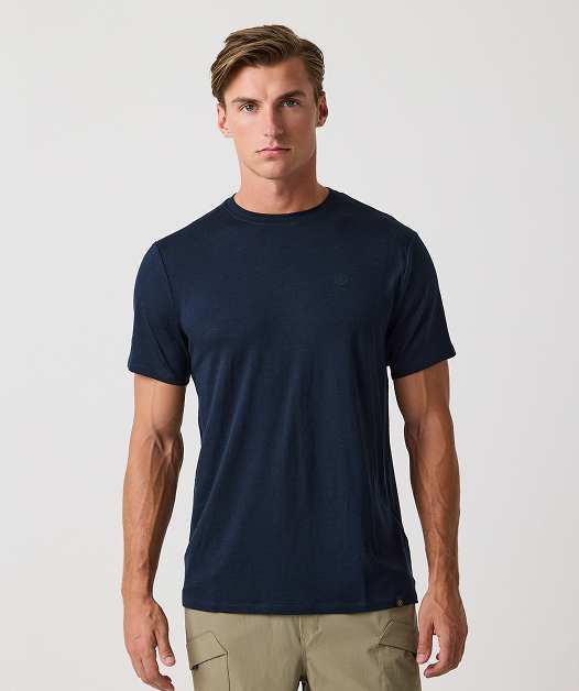 Man wearing navy t-shirt and khaki pants.