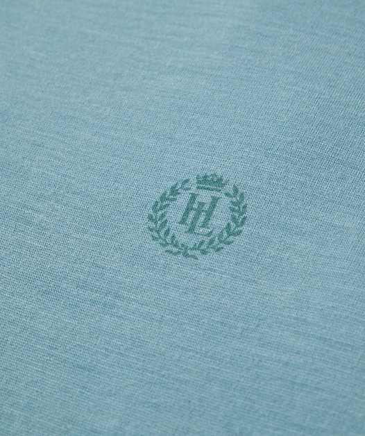 Blue fabric with circular emblem in center.