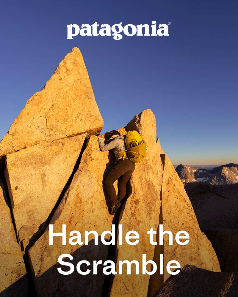 Patagonia® | A person wearing a backpack makes a final climb to the summit of a jagged granite peak. | Handle the Scramble