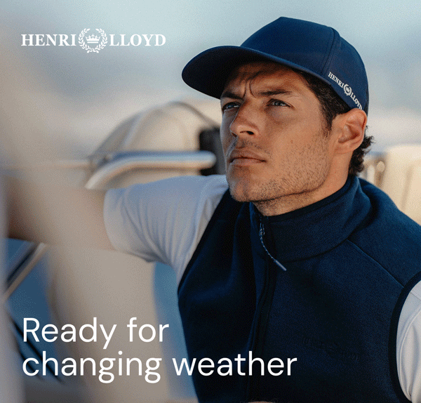 Man in cap and vest on a boat, Henri Lloyd logo.