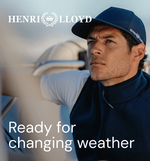 Man in cap and vest on a boat, Henri Lloyd ad.